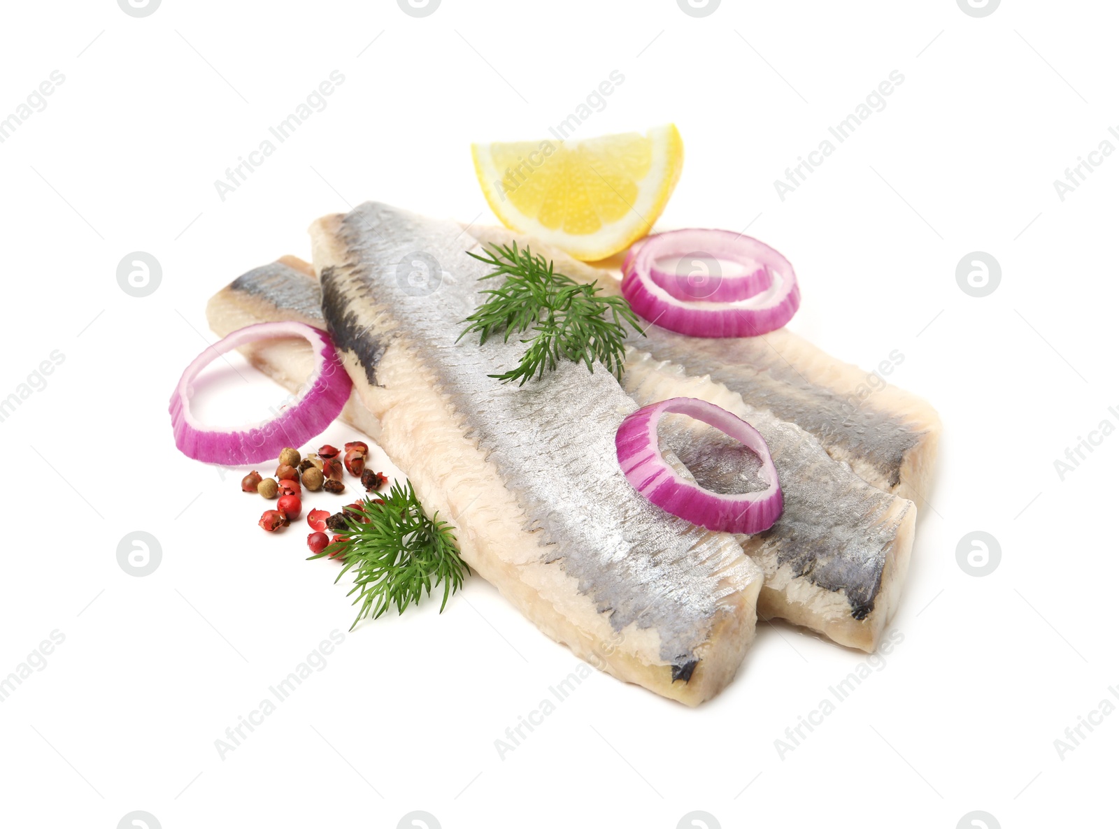 Photo of Marinated herring fillets with dill, onion rings, peppercorns and lemon isolated on white