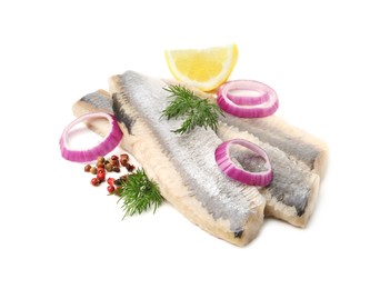 Photo of Marinated herring fillets with dill, onion rings, peppercorns and lemon isolated on white