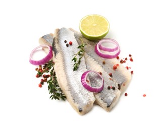 Photo of Marinated herring fillets with thyme, onion rings, peppercorns and lime isolated on white