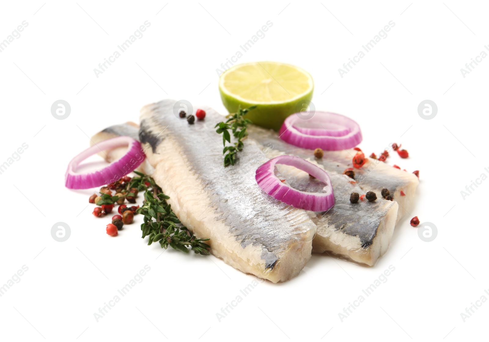 Marinated herring fillets with thyme, onion rings, peppercorns and lime isolated on white Photo of Marinated herring fillets with thyme, onion rings, peppercorns and lime isolated on white