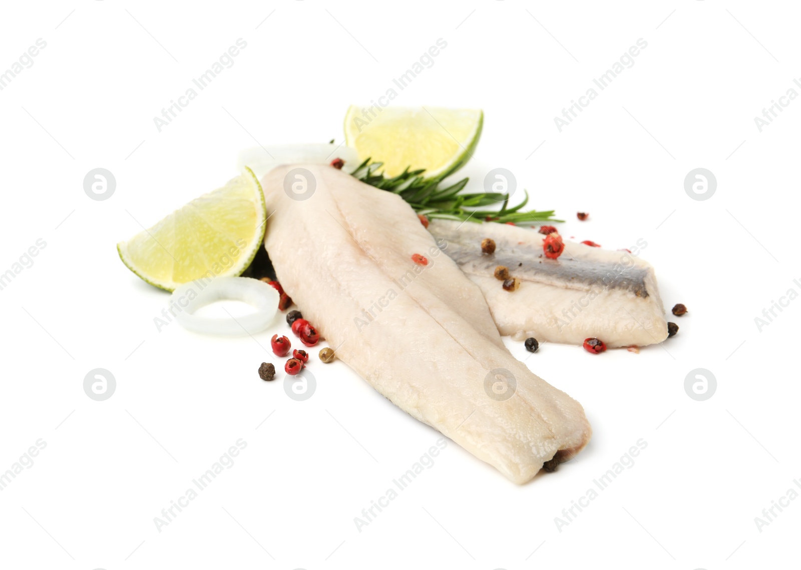 Photo of Marinated herring fillets with rosemary, onion rings, peppercorns and lime isolated on white