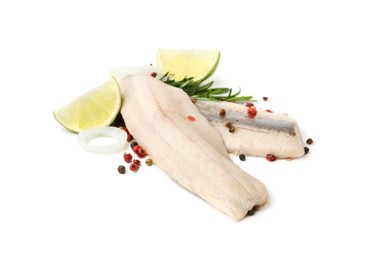 Marinated herring fillets with rosemary, onion rings, peppercorns and lime isolated on white