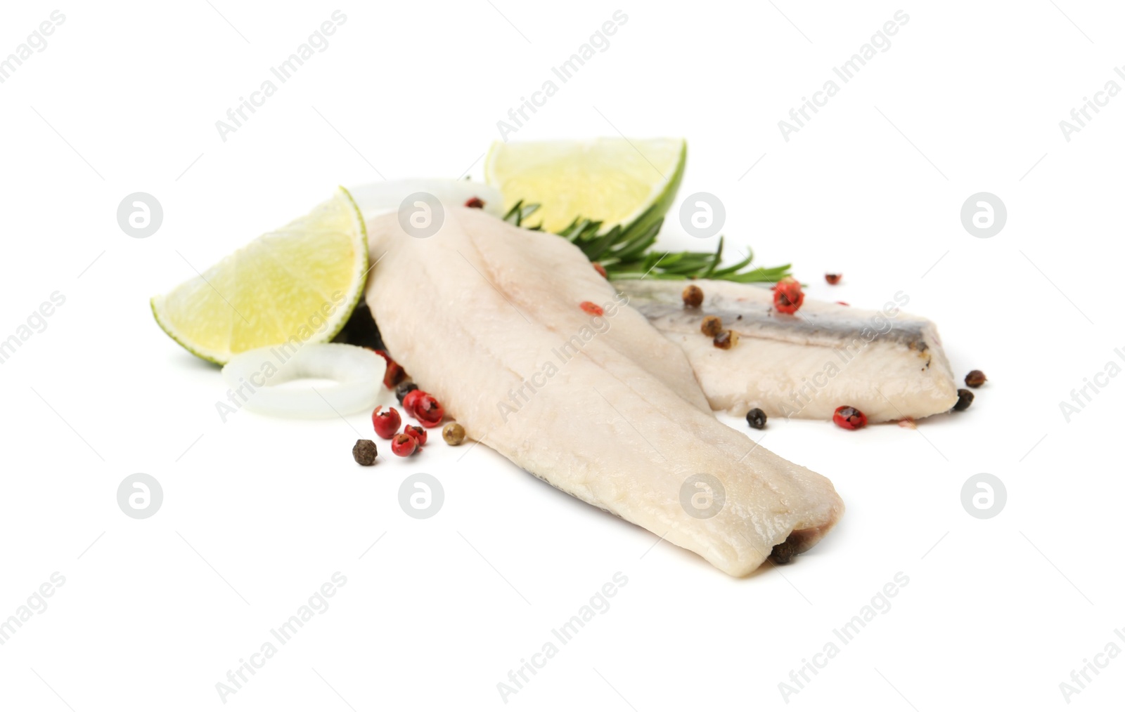 Photo of Marinated herring fillets with rosemary, onion rings, peppercorns and lime isolated on white