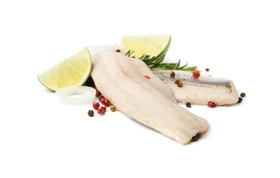 Photo of Marinated herring fillets with rosemary, onion rings, peppercorns and lime isolated on white