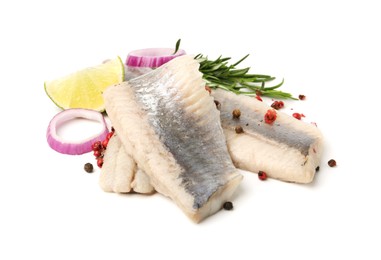 Photo of Marinated herring fillets with rosemary, onion rings, peppercorns and lime isolated on white