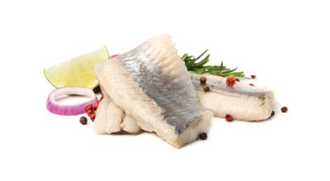 Photo of Marinated herring fillets with rosemary, onion ring, peppercorns and lime isolated on white