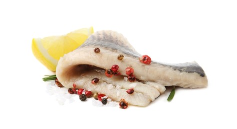 Photo of Marinated herring fillet with rosemary, salt, peppercorns and lemon isolated on white