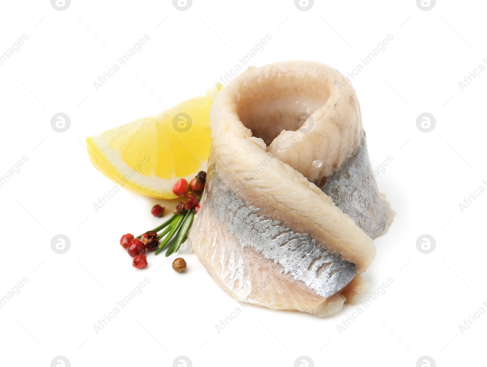 Photo of Marinated herring fillet with rosemary, peppercorns and lemon isolated on white