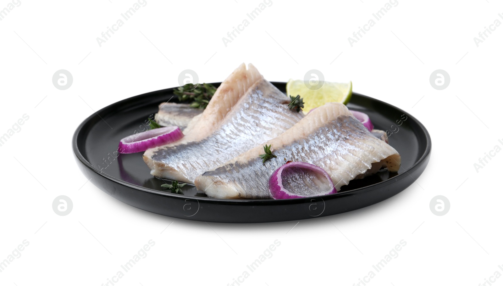 Photo of Marinated herring fillets with onion rings, thyme and lime isolated on white