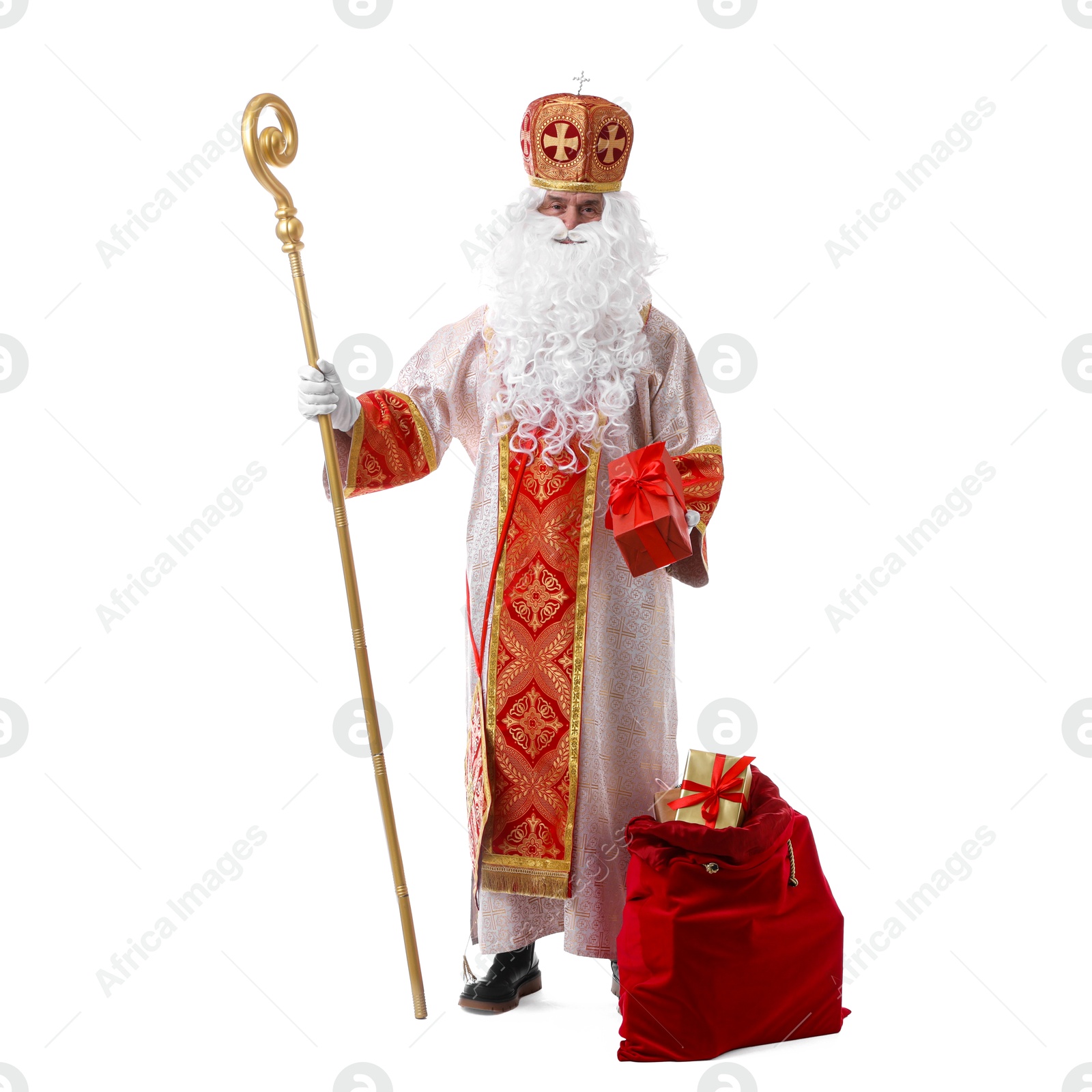 Photo of Saint Nicholas with sack full of gifts on white background