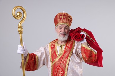 Saint Nicholas with sack on light grey background