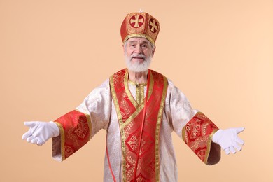 Photo of Portrait of happy Saint Nicholas on beige background