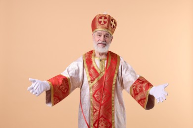 Portrait of happy Saint Nicholas on beige background