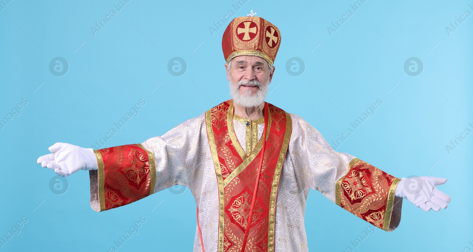 Photo of Happy Saint Nicholas on light blue background