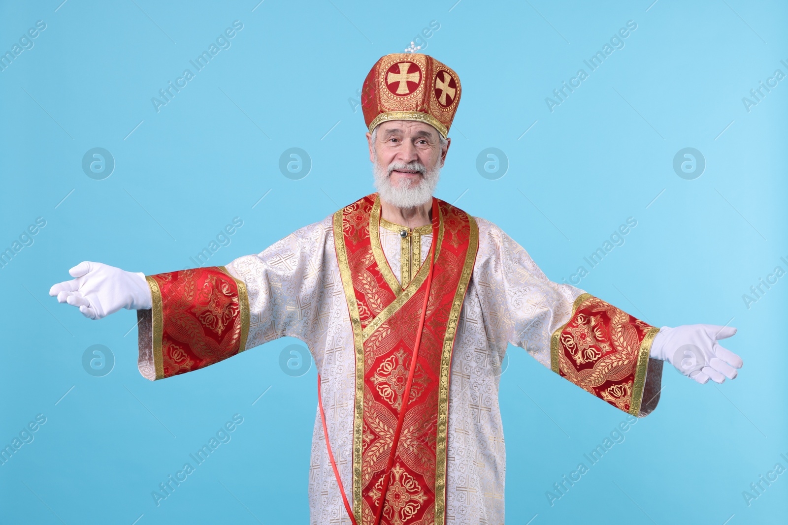 Photo of Happy Saint Nicholas on light blue background