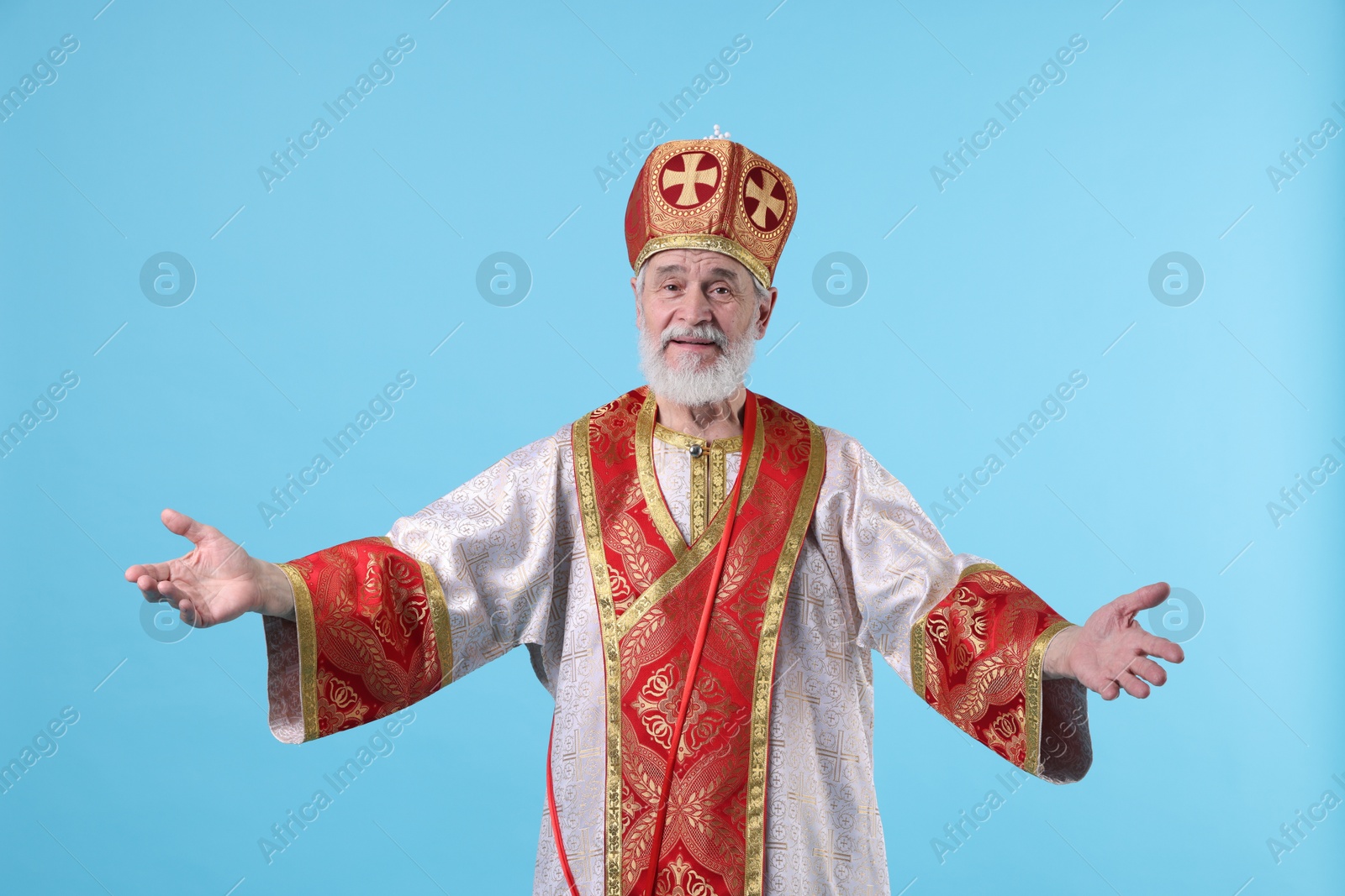 Photo of Happy Saint Nicholas on light blue background