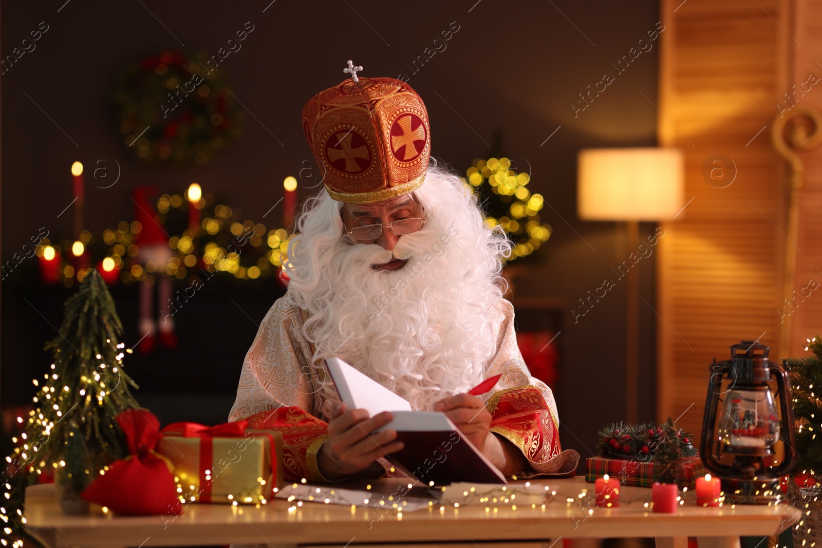 Photo of Saint Nicholas in room decorated for Christmas