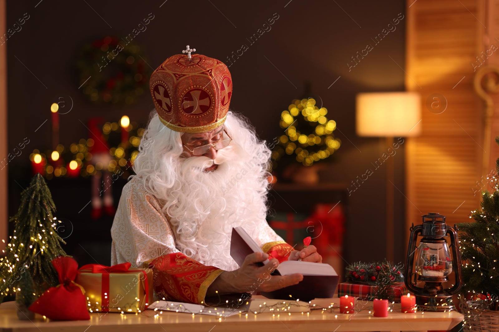 Photo of Saint Nicholas in room decorated for Christmas