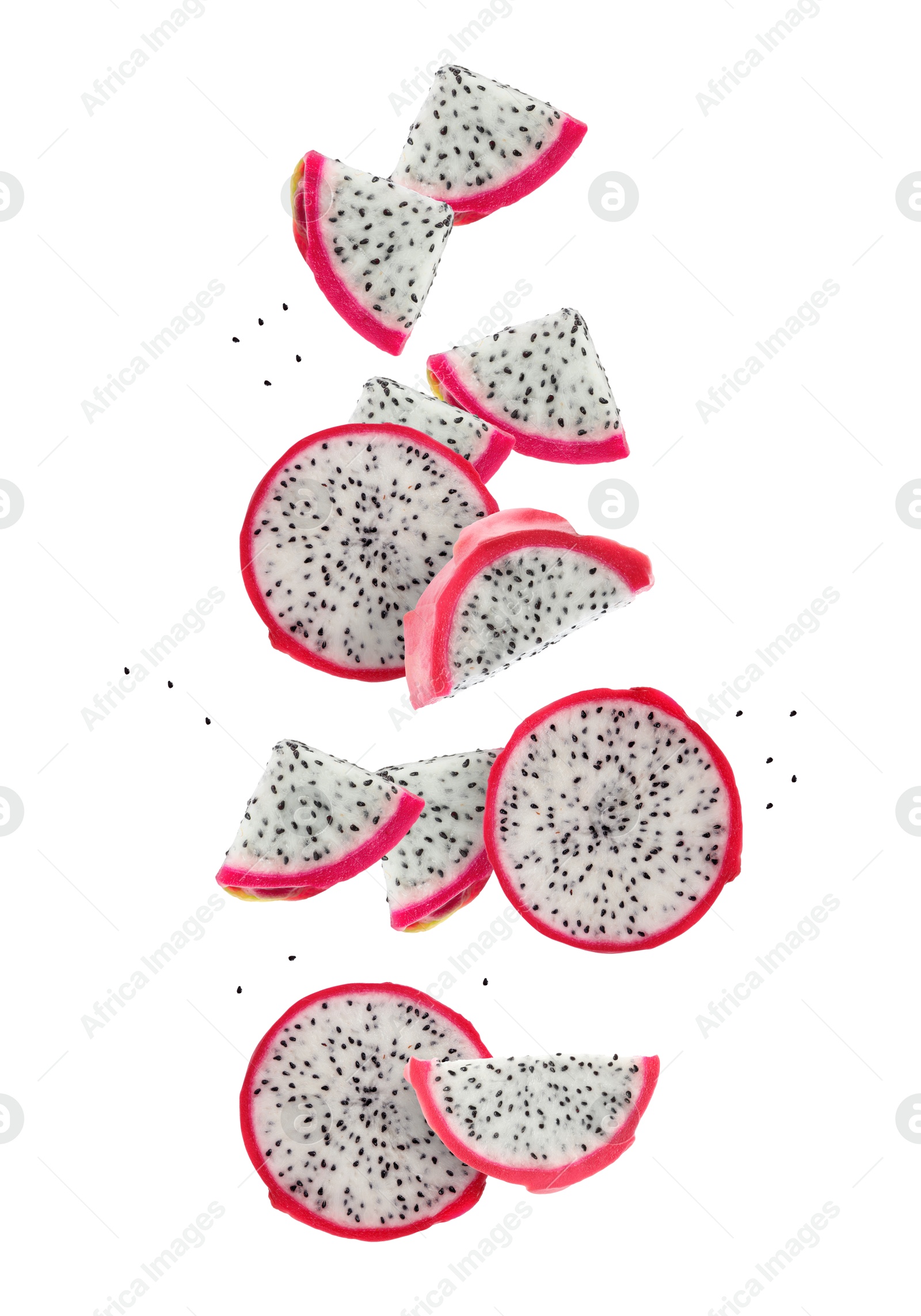 Image of Pieces of tasty pitaya fruit falling on white background