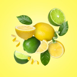 Image of Lemons, limes, zest and green leaves in air on yellow background