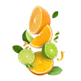 Image of Lime, orange, zest and green leaves in air on white background