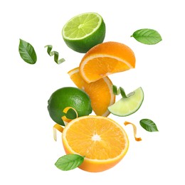 Image of Lime, orange, zest and green leaves in air on white background