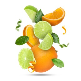 Image of Lime, orange, zest and green leaves in air on white background