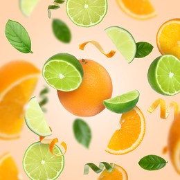 Image of Limes, oranges, zest and green leaves in air on pink background