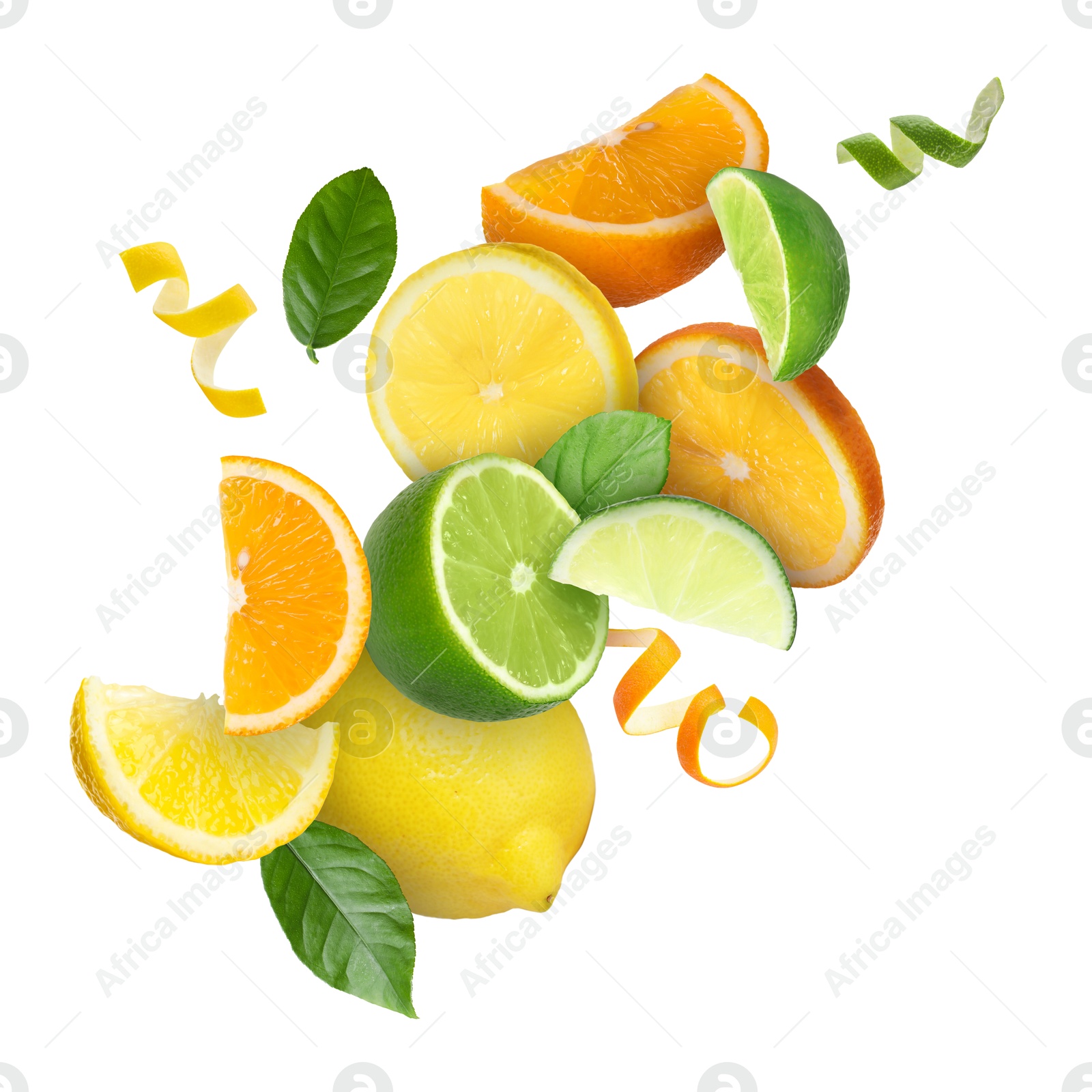 Lime, lemon, orange, zest and green leaves in air on white background Image of Lime, lemon, orange, zest and green leaves in air on white background