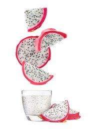 Image of Tasty pitahaya fruit pieces in air over glass of fresh smoothie on white background