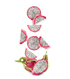 Image of Pieces of tasty pitaya fruit falling on white background