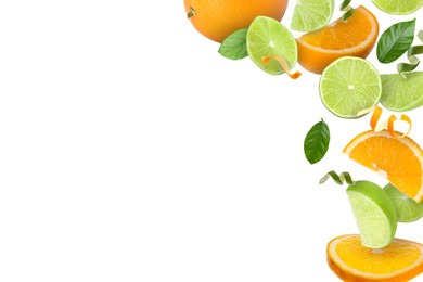 Image of Limes, oranges, zest and green leaves in air on white background