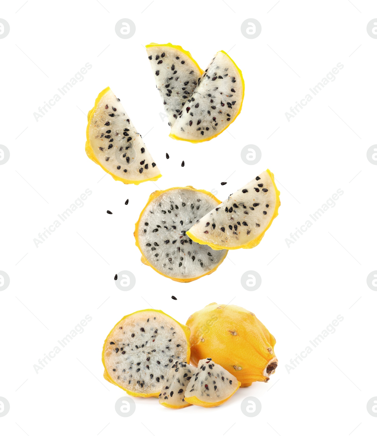 Image of Pieces of tasty pitaya fruit falling on white background