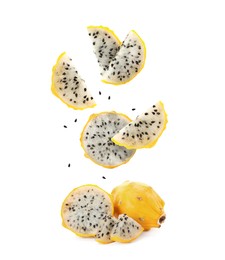 Image of Pieces of tasty pitaya fruit falling on white background