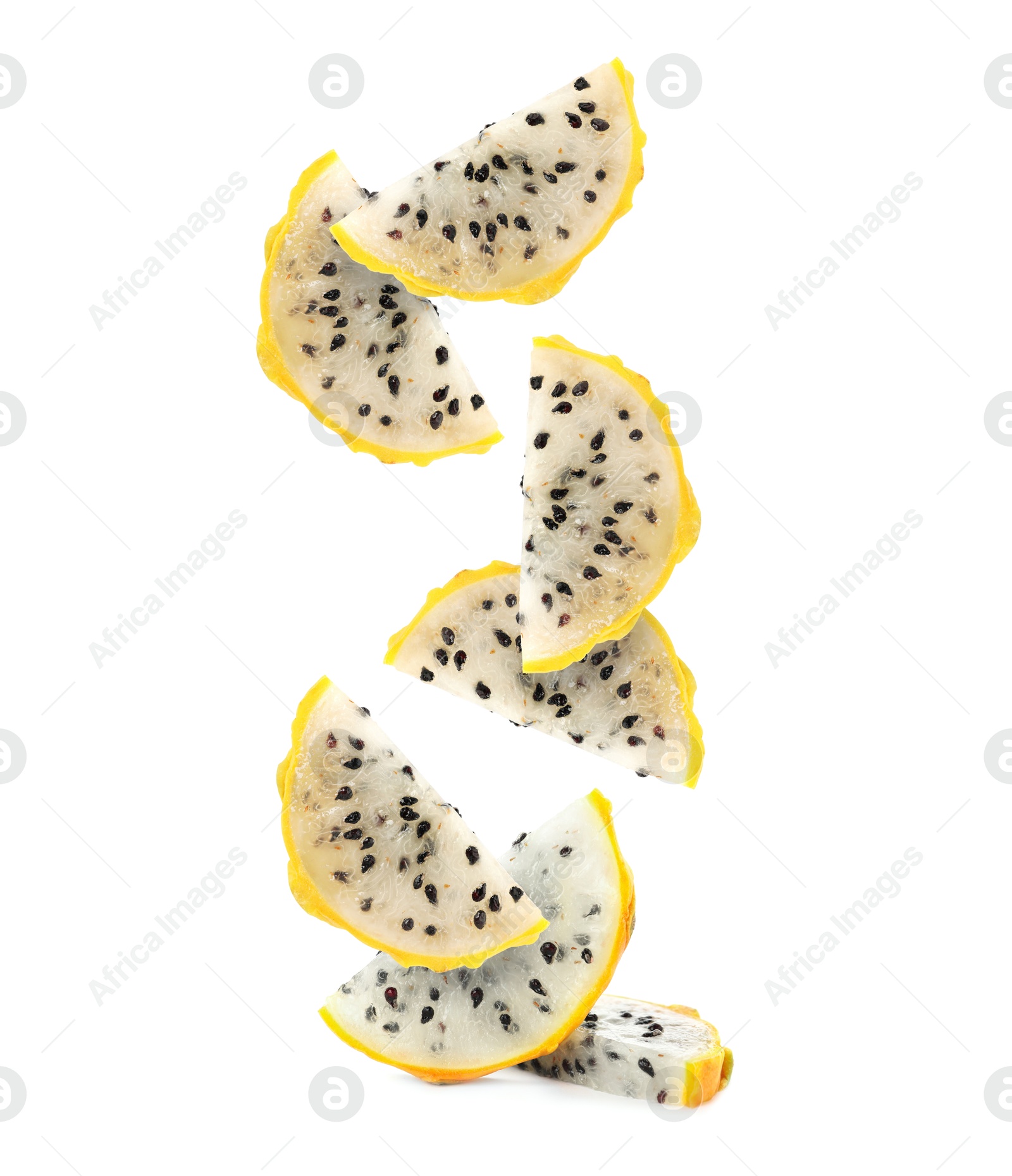 Image of Pieces of tasty pitaya fruit falling on white background