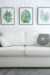 Photo of Comfortable white sofa in modern room. Interior design