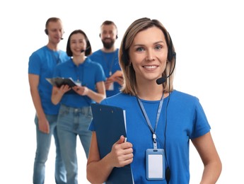 Photo of Technical support call center. Team of friendly operators on white background