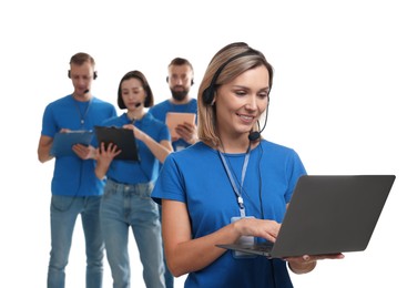 Photo of Technical support call center. Team of friendly operators on white background