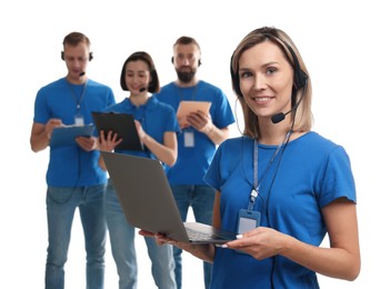 Photo of Technical support call center. Team of friendly operators on white background