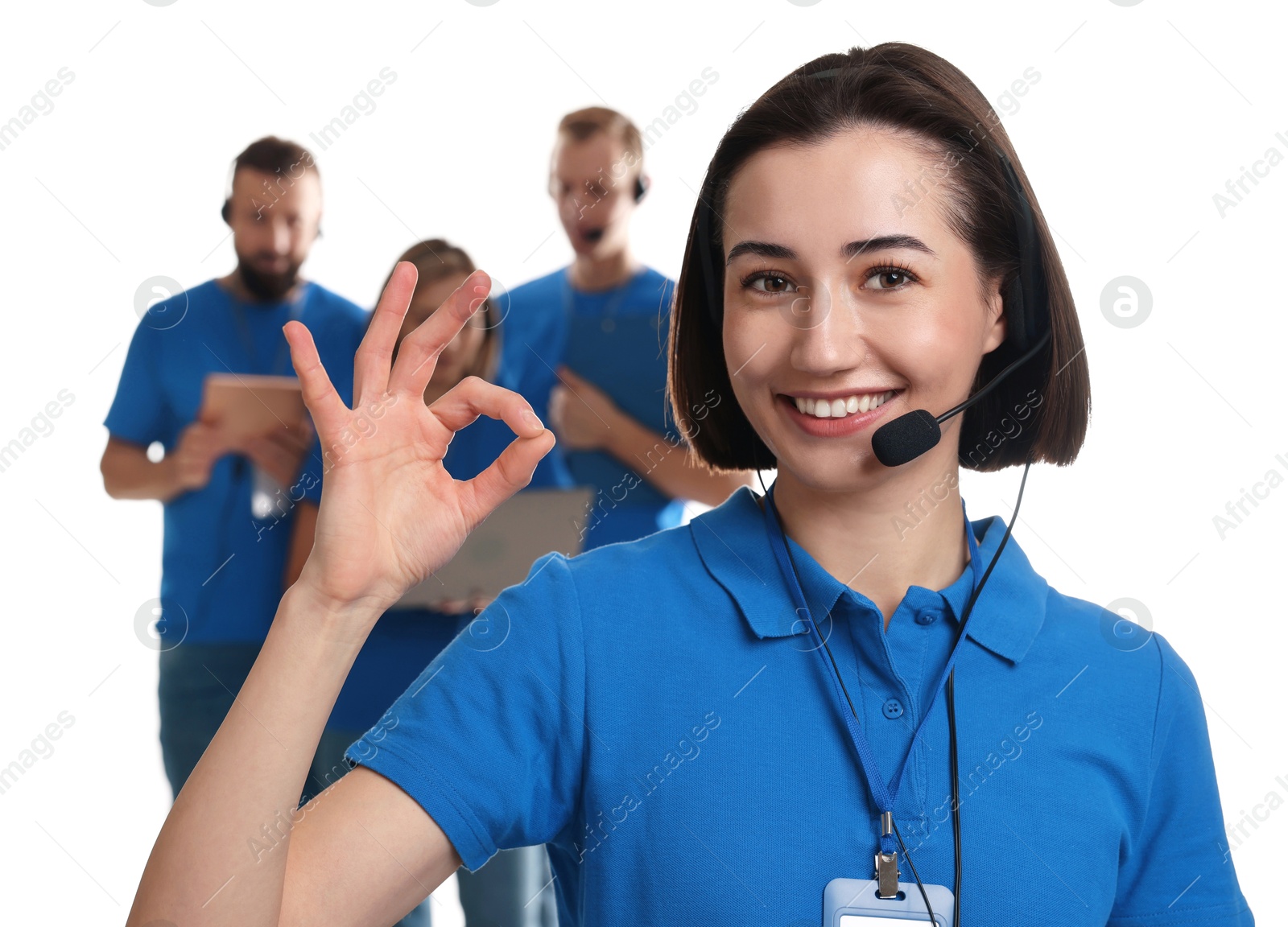 Photo of Technical support call center. Team of friendly operators on white background