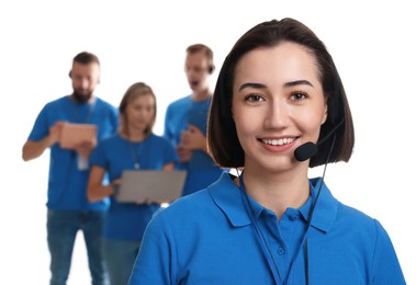 Photo of Technical support call center. Team of friendly operators on white background