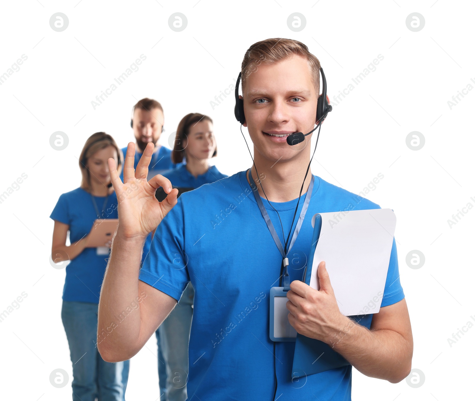 Photo of Technical support call center. Team of friendly operators on white background