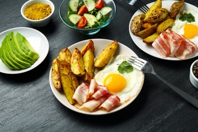 Photo of Tasty brunch served on dark textured table