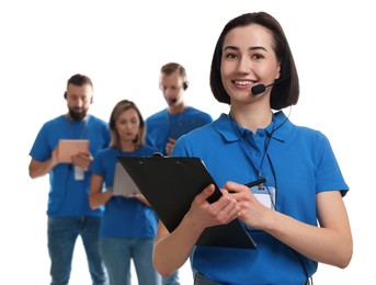 Photo of Technical support call center. Team of friendly operators on white background