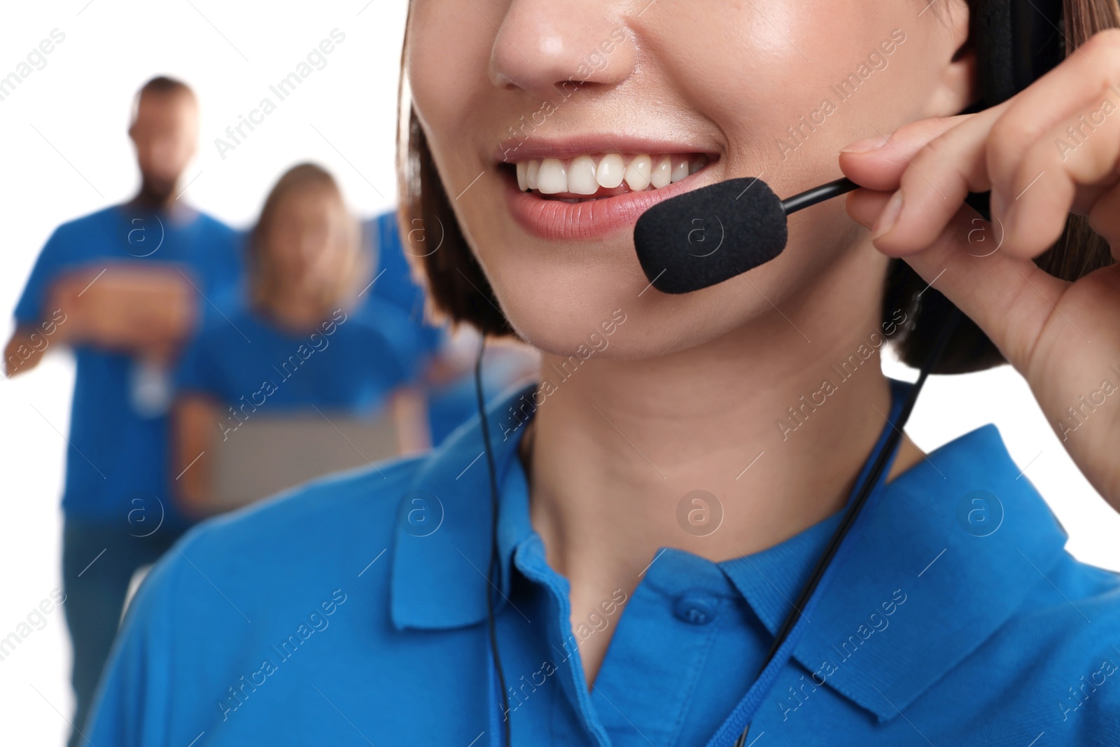 Photo of Technical support call center. Smiling operator on white background, closeup