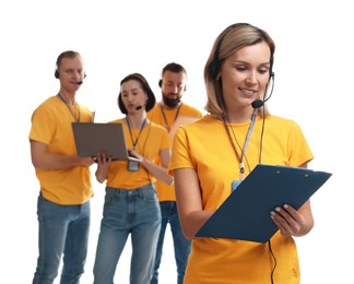 Photo of Technical support call center. Team of friendly operators on white background