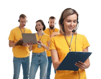 Photo of Technical support call center. Team of friendly operators on white background