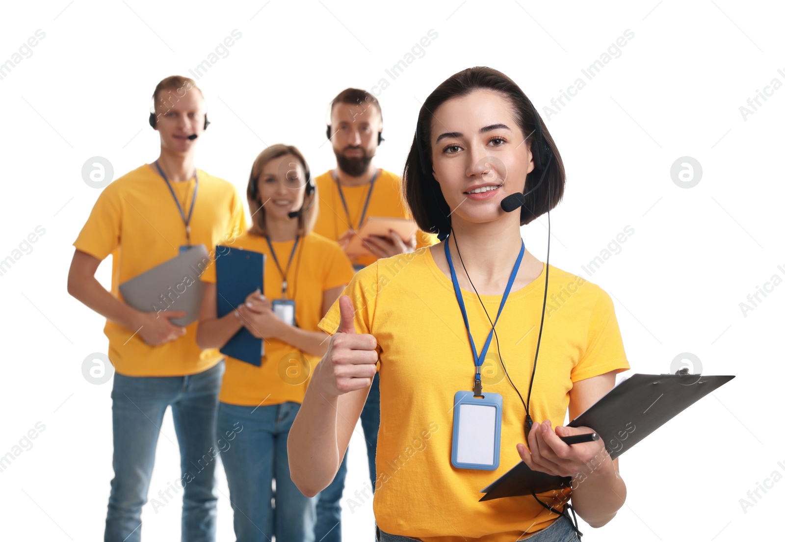 Photo of Technical support call center. Team of friendly operators on white background