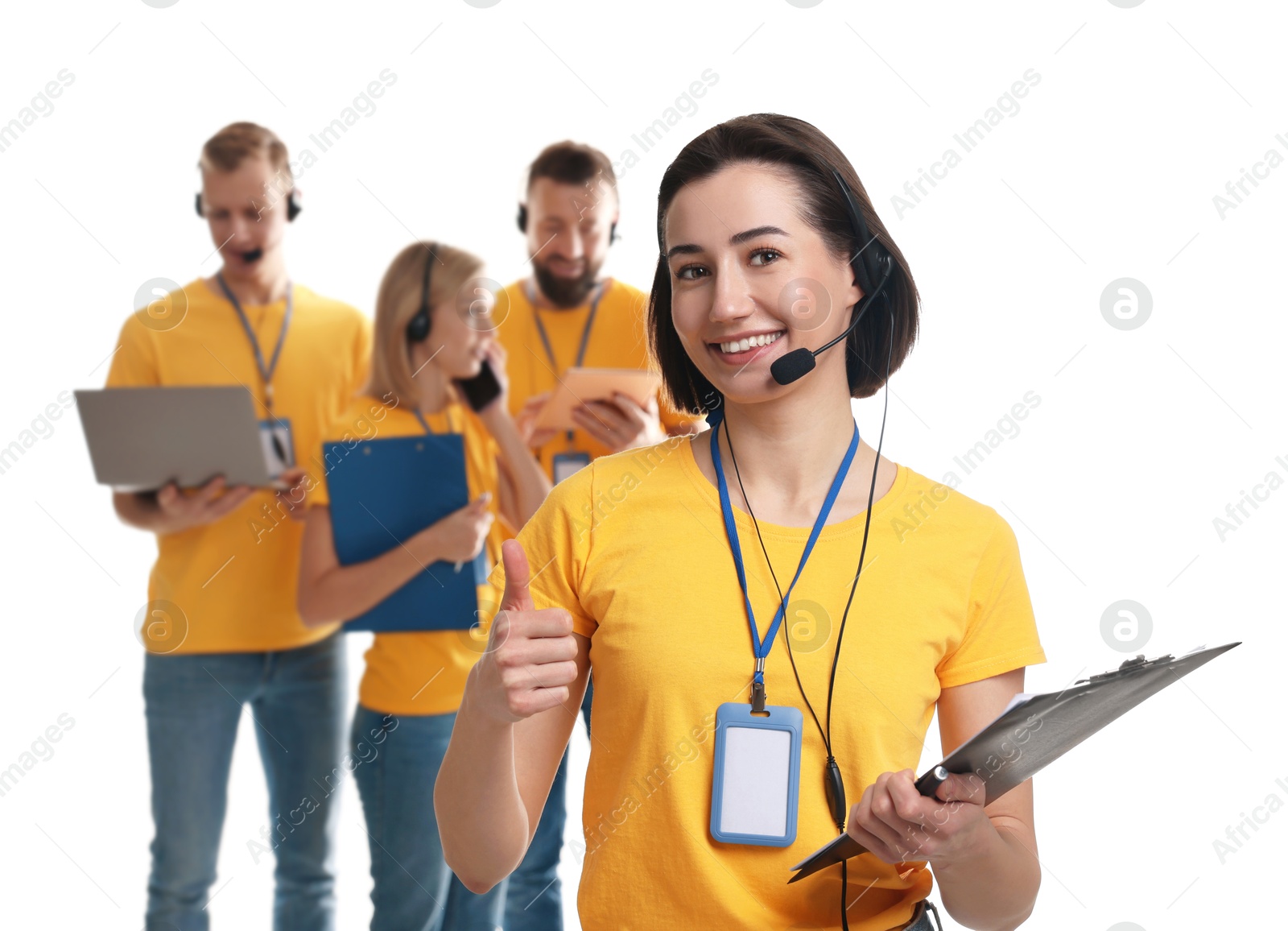 Photo of Technical support call center. Team of friendly operators on white background