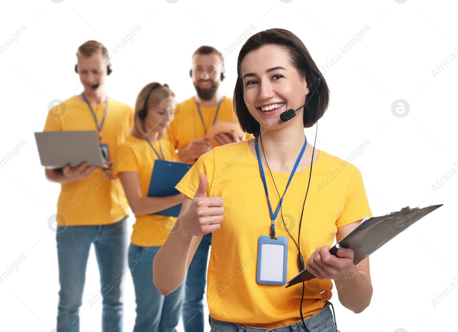 Photo of Technical support call center. Team of friendly operators on white background